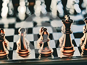 Business game competitive strategy with chess board game with blur background