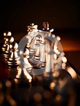 Business game competitive strategy with chess board game with blur background