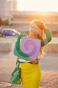 Business. Girl holds a folder.