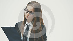 A business girl wearing a document folder and a friendly smile is standing on a white background.