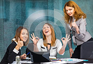 Business girls in the office and enjoy the success