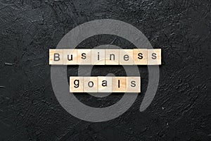 business GOAL word written on wood block. business GOAL text on cement table for your desing, concept