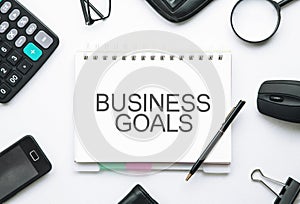 Business goals text on notepad. Business concept