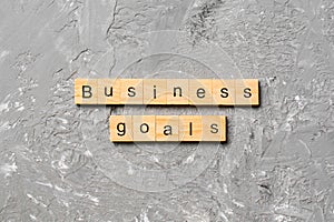 business GOALS word written on wood block. business GOALS text on cement table for your desing, concept