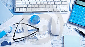 Business graphs, computer keyboard, pen, eyeglasses. Business. Analysis. Accounting