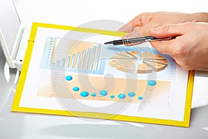 Business graphs and male hands