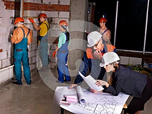 Business group people in builder helmet .