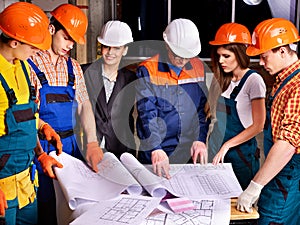 Business group people in builder helmet .