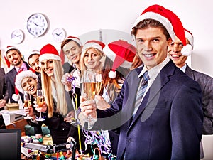 Business group people in santa hat at Xmas party.