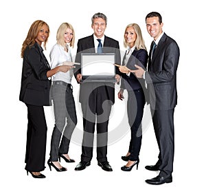 Business group pointing at the laptop