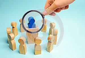 A business group stands in a circle and listens to the leader behind the tribune. Boss / CEO gives instructions. Business planning