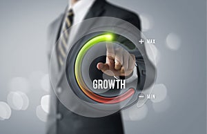 Business growth or career growth concept. Businessman is pulling up circle progress bar with the word GROWTH on bright tone