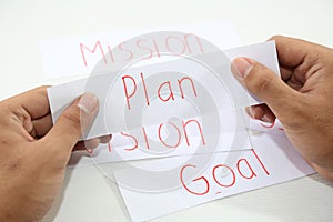 Business hand business plan idea in piece of paper