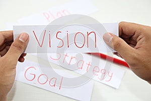 Business hand business vision idea in piece of paper