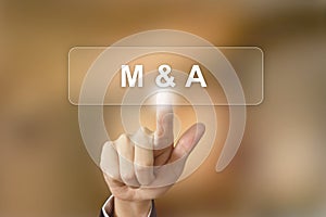 Business hand clicking merger and acquisition button on blurred