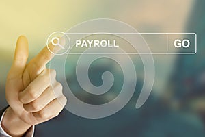 Business hand clicking payroll button on search toolbar