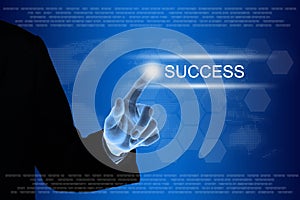 Business hand clicking success button on touch screen