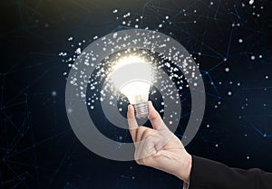 Business hand holding light bulb, concept of new ideas with innovation and creativity