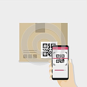 Business hand holding smartphone to scan QR code on box for detail of merchandise.