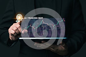 Business hand holding tablet press on the use of a trading robot analyzing investment diagram in business. Artificial Intelligence