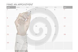 Business hand make an appointment on calender planner meeting.
