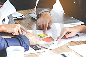 Business hand pointing at business document