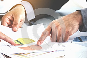 Business hand pointing at business document