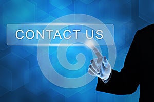 Business hand pushing contact us button