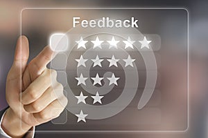 Business hand pushing feedback on virtual screen