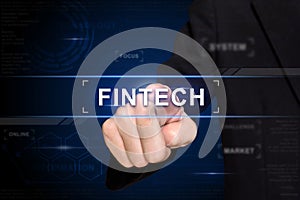 Business hand pushing fintech button on virtual screen