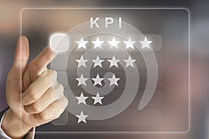 business hand pushing KPI or Key Performance Indicator on virtual screen