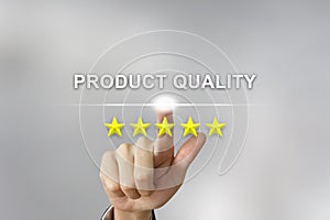 Business hand pushing product quality on screen