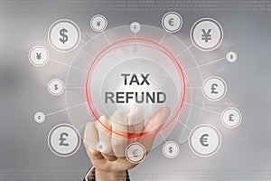 Business hand pushing tax refund button