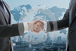 Business hand shake with digital graph