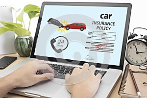 Business hand using computer with protection car insurance