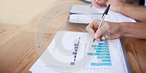 Business hands, paperwork and writing with data analysis, graphs and charts for financial report and budget in office