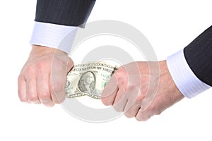 Business hands tearing money