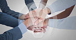 Business hands together with white lightbulb graphic