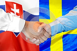 Handshake on Slovakia and Sweden flag background