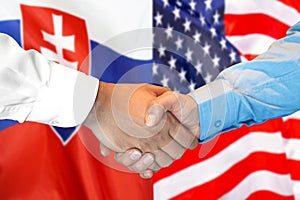 Handshake on Slovakia and US flag background