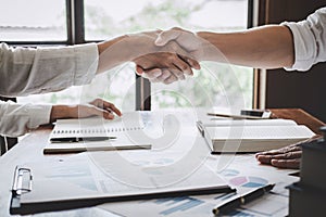 Business handshake after discussing good deal of Trading to sign agreement and become a business partner, contract for both