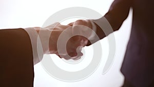 Business handshake - Hand holding on white background