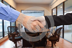 Business Handshake in meeting room concept