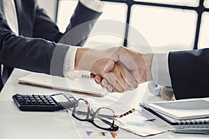 Business handshake in the office