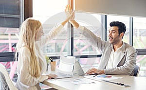 Business handshake in the office, International business team showing unity with their hands together