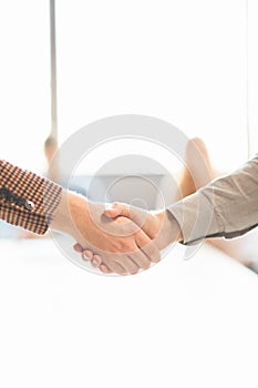 Business handshake. Two businessman shaking hands with each other outside