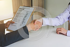 Business handshake. Two businessmen reaching an agreement and making a deal