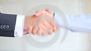 A Business Handshake. Two men shake hands. 4k, slow-motion