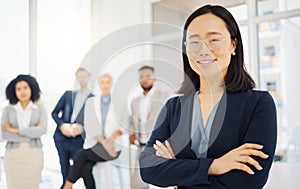 Business, happy and portrait of Asian woman in office with confidence, pride and motivation with team. Leadership