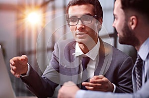 Business Having Meeting Around Table In Modern Office